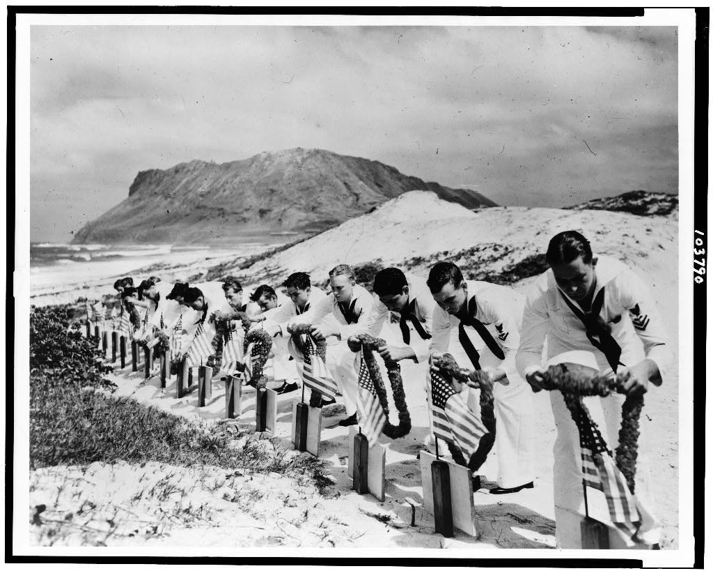 japans-surprise-attack-of-pearl-harbor-on-dec-7-1941-spurred-americas-entry-into-world-war-ii-this-photo-shows-a-memorial-service-for-sailors-killed-in-the-attack